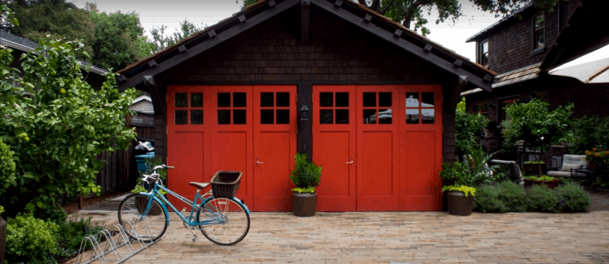 Bright Red-Orange Carriage-Style Garage Door with Windows