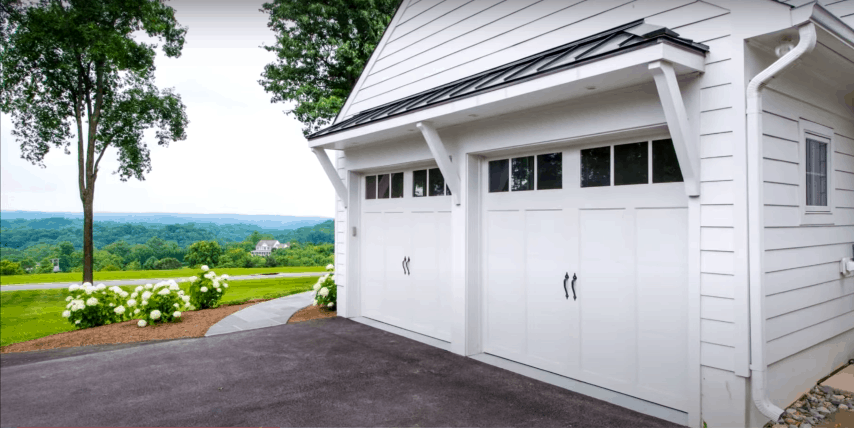 White Carriage-Style Garage Door in a Country Home